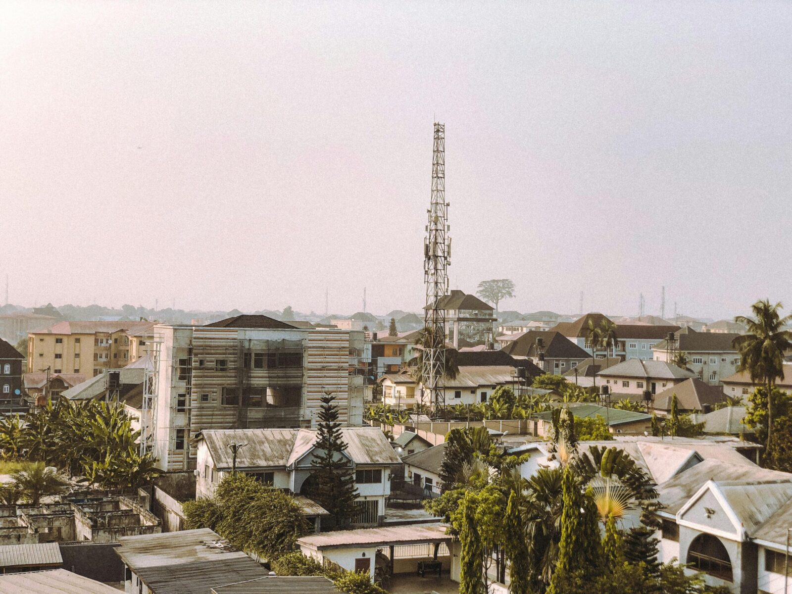 Explore the urban landscape of Port Harcourt, Nigeria with distinct buildings and lush greenery.