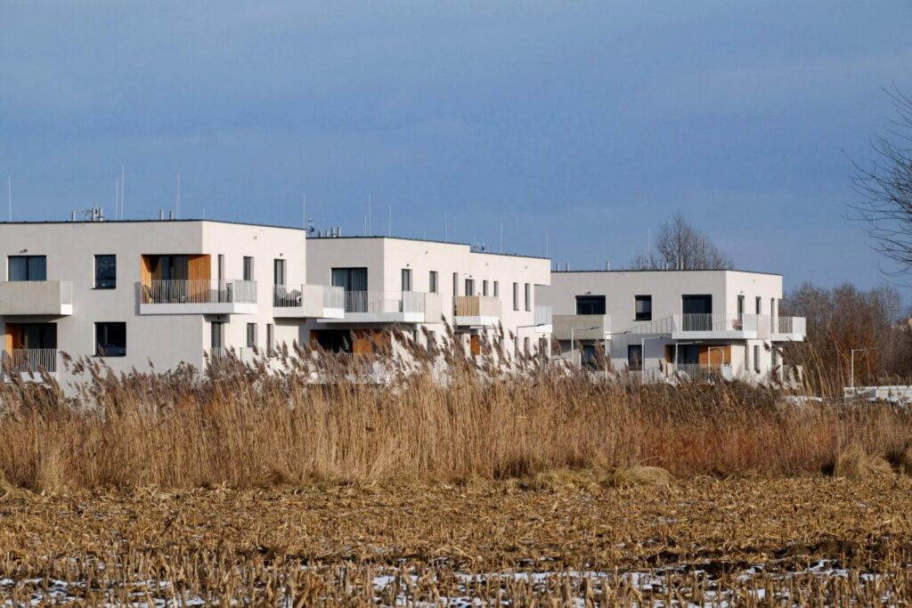 White modern apartments against a natural background during winter.